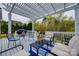 The rear deck is furnished with patio furniture and overlooks the backyard at 615 Reliance Ct, Tega Cay, SC 29708