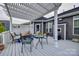The rear deck has an outdoor seating area under a pergola with white beams and posts at 615 Reliance Ct, Tega Cay, SC 29708