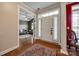 Warm and welcoming foyer with hardwood floors and view into the living room at 615 Reliance Ct, Tega Cay, SC 29708