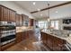 Modern kitchen featuring stainless steel appliances, granite countertops, and ample cabinet space at 615 Reliance Ct, Tega Cay, SC 29708