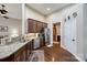 Well-appointed kitchen boasts stainless steel appliances, custom cabinets, and granite countertops at 615 Reliance Ct, Tega Cay, SC 29708