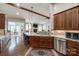Open-concept kitchen with a view to the living room, stainless steel appliances, and granite countertops at 615 Reliance Ct, Tega Cay, SC 29708