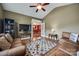 Cozy living room with hardwood floors, comfortable seating, and inviting atmosphere at 615 Reliance Ct, Tega Cay, SC 29708