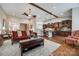 Inviting open-concept layout seamlessly connecting the living room and kitchen with a ceiling fan at 615 Reliance Ct, Tega Cay, SC 29708