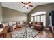 Comfortable living room with vaulted ceiling, hardwood floors, and ample seating at 615 Reliance Ct, Tega Cay, SC 29708