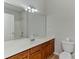 A bathroom featuring a white vanity, a large mirror, and a shower and tub combo at 6512 Quarterbridge Ln, Charlotte, NC 28262
