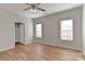 Comfortable bedroom provides ample space and natural light from two windows at 6512 Quarterbridge Ln, Charlotte, NC 28262