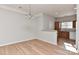 Open dining area with wood floors and modern lighting, flowing into the kitchen at 6512 Quarterbridge Ln, Charlotte, NC 28262