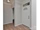 Bright entrance hall with wood flooring and neutral wall paint creates a welcoming atmosphere at 6512 Quarterbridge Ln, Charlotte, NC 28262