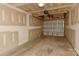 Spacious garage with unfinished walls and concrete floors at 6512 Quarterbridge Ln, Charlotte, NC 28262