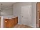 Kitchen area boasts wooden cabinetry and a breakfast bar overlooking the dining area at 6512 Quarterbridge Ln, Charlotte, NC 28262