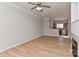 Spacious living room with wood floors, ceiling fan and fireplace at 6512 Quarterbridge Ln, Charlotte, NC 28262