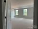 A very spacious bedroom with two windows allowing for lots of natural light at 6707 Baker Creek Ave, Indian Land, SC 29707
