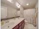 Bright bathroom features a double sink vanity, framed mirrors, and warm neutral colors at 7138 Dove Field Ln, Indian Land, SC 29707