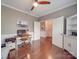Comfortable bedroom with hardwood floors, chair railing, and natural light at 7138 Dove Field Ln, Indian Land, SC 29707