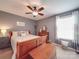 Cozy bedroom with a wood bed frame, nightstands, and window at 7138 Dove Field Ln, Indian Land, SC 29707