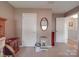 Upstairs bedroom with neutral carpet and easy access to attic storage at 7138 Dove Field Ln, Indian Land, SC 29707