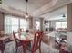 Dining room with hardwood floors, natural light, and modern lighting fixture at 7138 Dove Field Ln, Indian Land, SC 29707