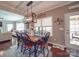Bright dining room features an elegant light fixture and access to outdoor patio at 7138 Dove Field Ln, Indian Land, SC 29707