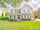 Charming two-story home with well-maintained lawn and landscaped front yard at 7138 Dove Field Ln, Indian Land, SC 29707