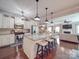 Open kitchen with stainless steel appliances, granite countertops and hardwood floors at 7138 Dove Field Ln, Indian Land, SC 29707