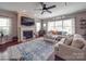 Spacious living room featuring a fireplace, hardwood floors, and ample natural light at 7138 Dove Field Ln, Indian Land, SC 29707