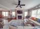 Spacious living room featuring a fireplace, hardwood floors, and ample natural light at 7138 Dove Field Ln, Indian Land, SC 29707