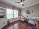 Cozy living room with hardwood floors, and natural light, perfect for relaxation at 7138 Dove Field Ln, Indian Land, SC 29707