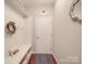 Organized mudroom entry with built-in bench, storage cubbies and decor at 7138 Dove Field Ln, Indian Land, SC 29707