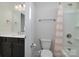 Practical bathroom with a single vanity, standard toilet, and a shower with peach colored shower curtain at 8313 Balcony Bridge Rd, Huntersville, NC 28078