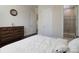Comfortable bedroom featuring a dark wood dresser and an en-suite bathroom with glass shower at 8313 Balcony Bridge Rd, Huntersville, NC 28078