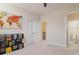 Bedroom features a colorful world map on the wall, white doors and a black bookshelf at 8313 Balcony Bridge Rd, Huntersville, NC 28078