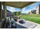 Covered patio with comfortable seating and a view of the expansive backyard at 8313 Balcony Bridge Rd, Huntersville, NC 28078
