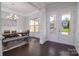 Elegant dining room with a modern chandelier and wainscoting at 8313 Balcony Bridge Rd, Huntersville, NC 28078
