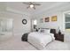 Spacious main bedroom with tray ceilings, an ensuite bathroom, and large windows with backyard views at 8313 Balcony Bridge Rd, Huntersville, NC 28078