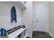 Functional mudroom with coat hooks, a bench, and cubbies for easy storage of outdoor gear and accessories at 8313 Balcony Bridge Rd, Huntersville, NC 28078