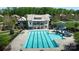 Community pool area with a large swimming pool, waterslide, and seating at 8313 Balcony Bridge Rd, Huntersville, NC 28078