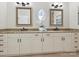 Bathroom with double sinks, granite countertops, decorative mirrors, and tile flooring at 8623 Tullamore Park Cir, Charlotte, NC 28226