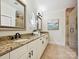 Elegant bathroom with double vanity, granite counters, framed mirrors, and a glass enclosed shower at 8623 Tullamore Park Cir, Charlotte, NC 28226