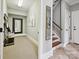 Hallway with mirror and view to another room with staircase at 8623 Tullamore Park Cir, Charlotte, NC 28226