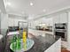 Modern kitchen with stainless steel appliances, granite countertops, and ample cabinet space at 8623 Tullamore Park Cir, Charlotte, NC 28226
