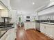 Spacious kitchen with stainless steel appliances and granite countertops with an easy flow to the living room at 8623 Tullamore Park Cir, Charlotte, NC 28226