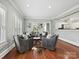 Inviting living room area featuring a cowhide rug, modern seating, and natural light at 8623 Tullamore Park Cir, Charlotte, NC 28226