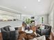 Spacious open-concept living room boasts hardwood floors, modern furniture, and neutral wall color at 8623 Tullamore Park Cir, Charlotte, NC 28226