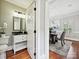 Convenient powder room adjacent to dining area, featuring modern fixtures and neutral color palette at 8623 Tullamore Park Cir, Charlotte, NC 28226