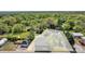 Aerial view showcasing the building and boundary lines with surrounding lush greenery at 8974, 8972 & 8970 Nc 90 E Hwy, Stony Point, NC 28678