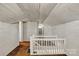 Attic hallway with brown carpet, white walls, and staircase with white railings at 8974, 8972 & 8970 Nc 90 E Hwy, Stony Point, NC 28678