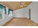 Inviting bedroom featuring wood ceiling, hardwood floors, large windows, and ample light at 8974, 8972 & 8970 Nc 90 E Hwy, Stony Point, NC 28678