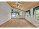 Bright bedroom with wood ceiling, hardwood floors, large windows, and natural light at 8974, 8972 & 8970 Nc 90 E Hwy, Stony Point, NC 28678
