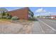 Brick building situated on a corner lot with street access and grassy areas at 8974, 8972 & 8970 Nc 90 E Hwy, Stony Point, NC 28678